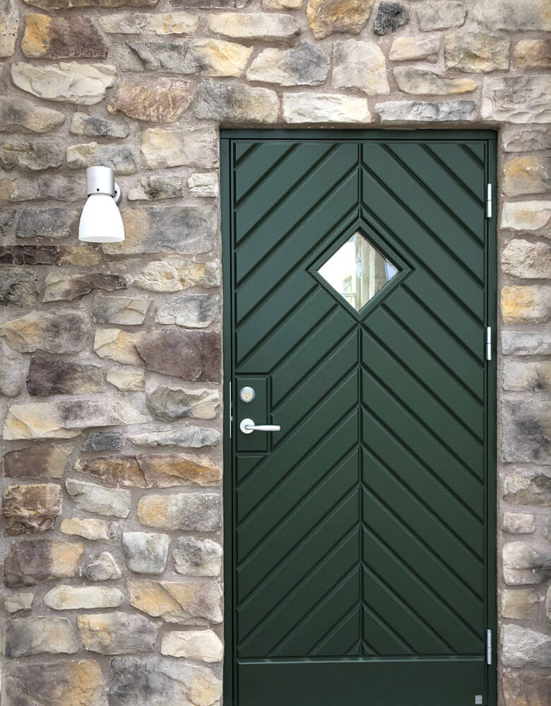Pivot door with pull handle in patinated bronze from FSB