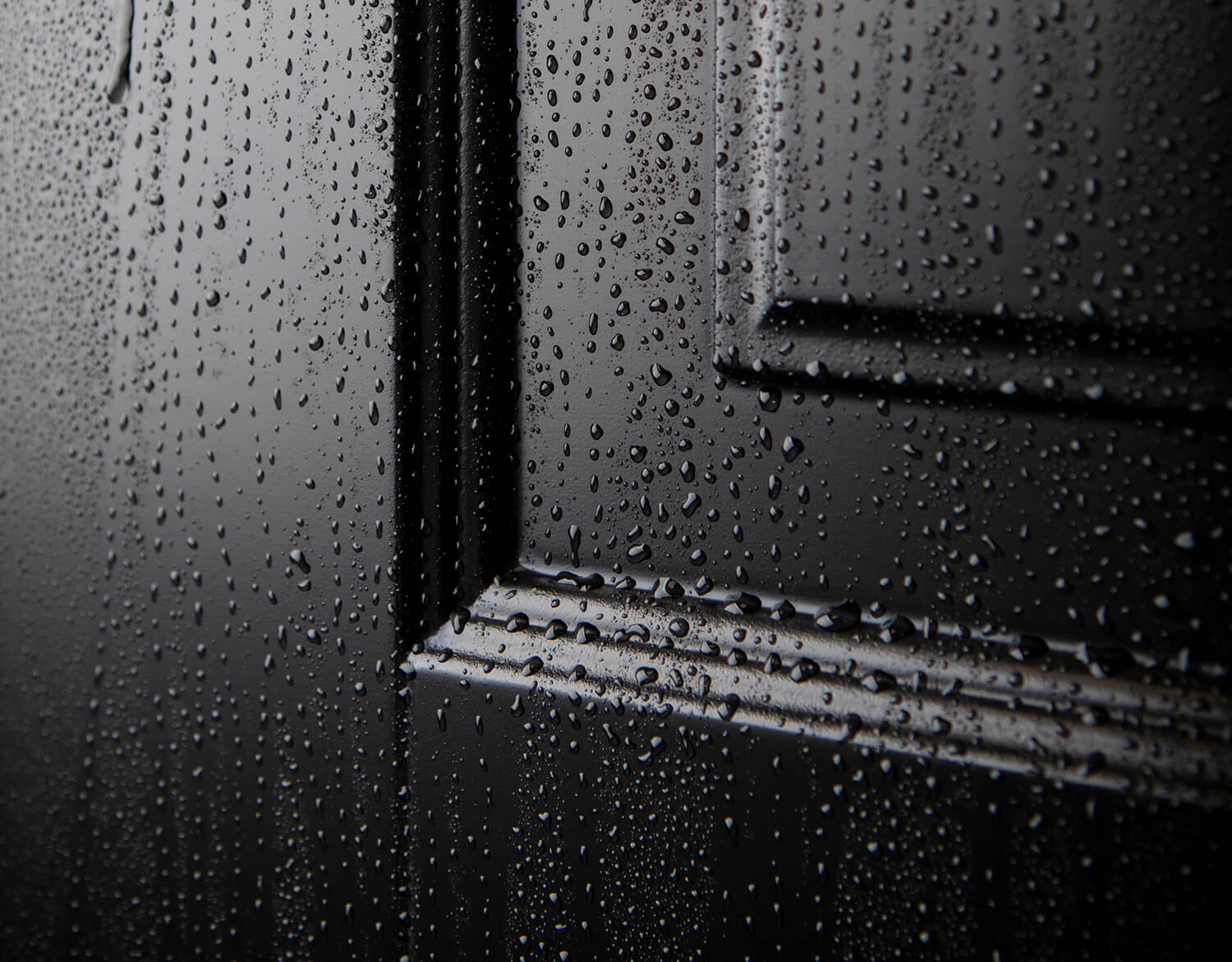 Water drops on Ekstrands' black exterior door model Ascot