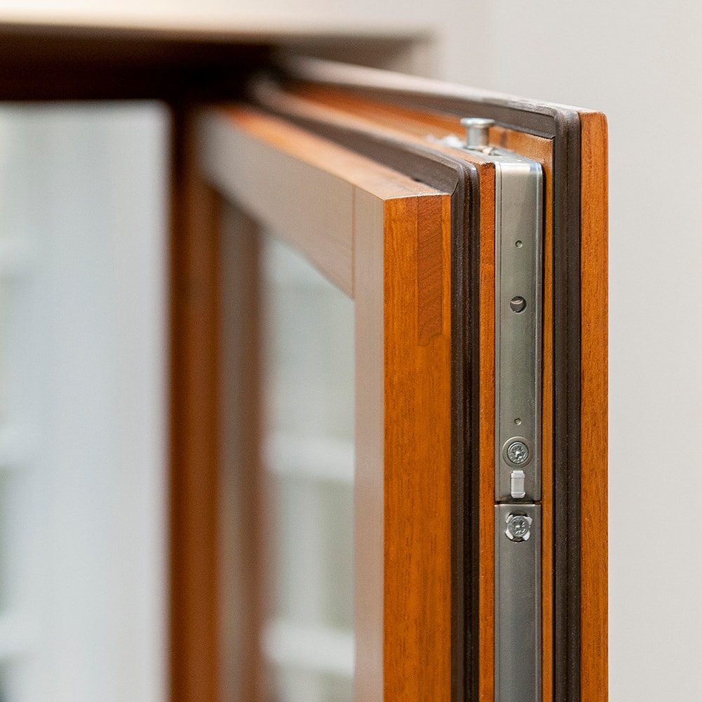 Inward-opening wooden windows with transparent satin